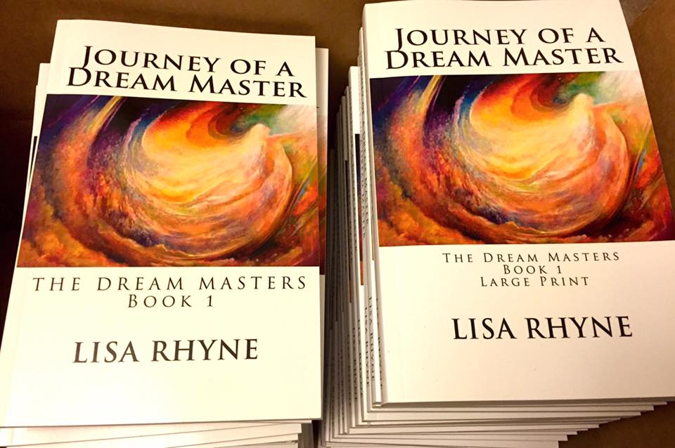Stacks of "Journey of a Dream Master" books.