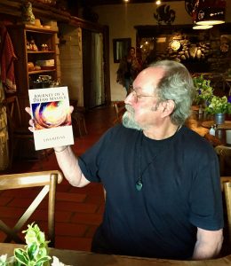 Hank Wesselman holding book, Journey of a Dream Master by Lisa Rhyne